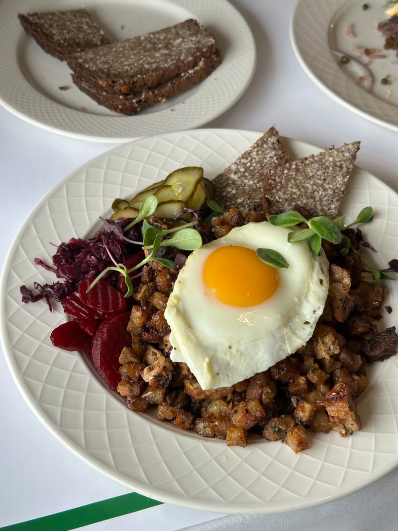 Biksemad with fried egg, pickled beets, and dark rye crispbread at Jómfrúin